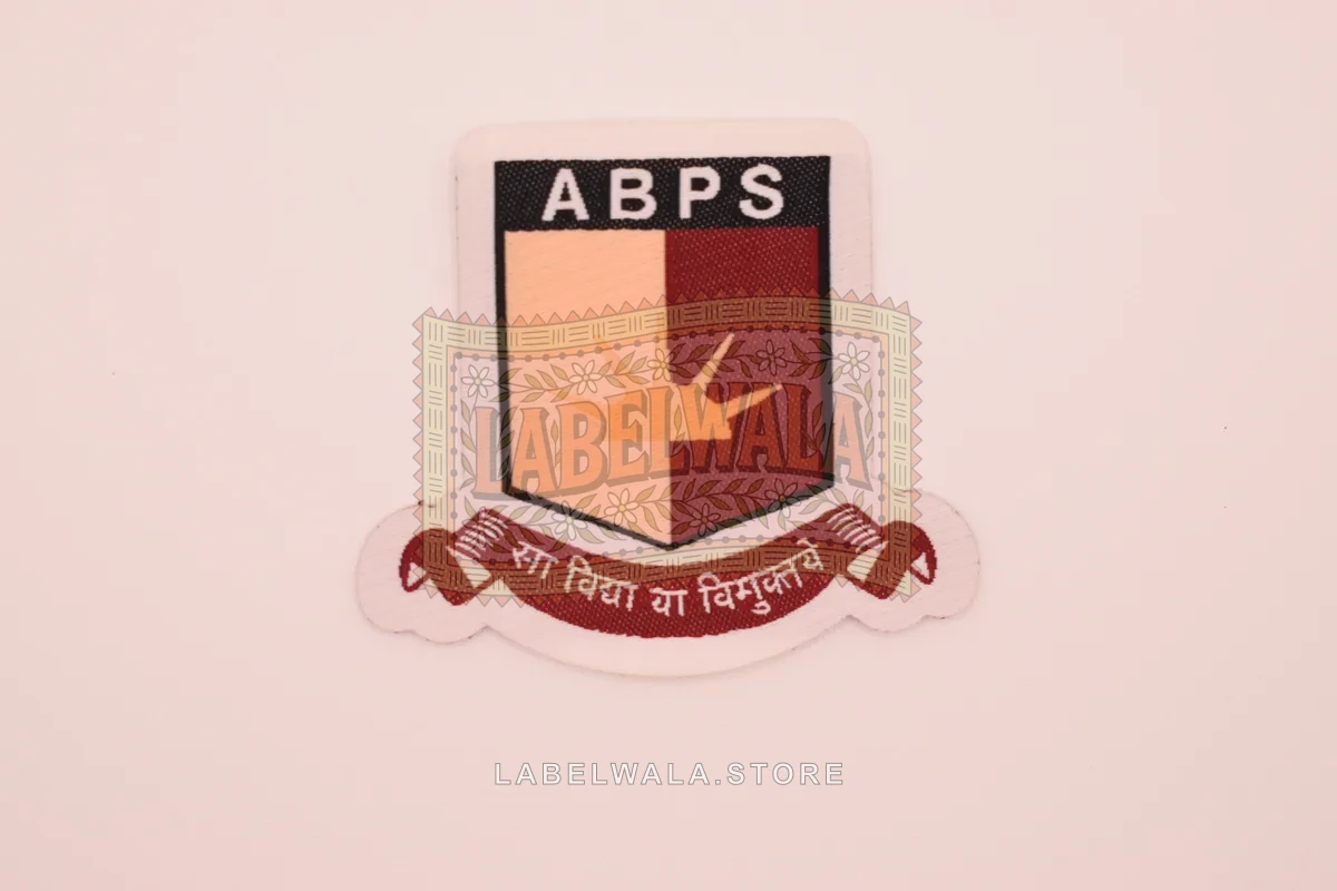 ABPS woven die cut label, made in Ahmedabad: front view