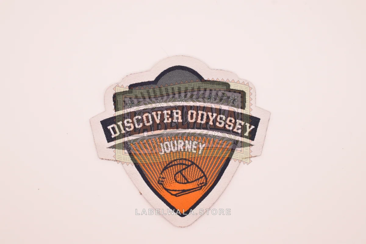 Odysser woven die cut label, made in Ahmedabad: front view