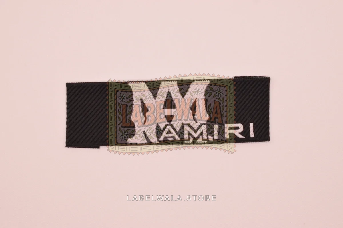 Amiri woven end fold label, made in Ahmedabad: front view