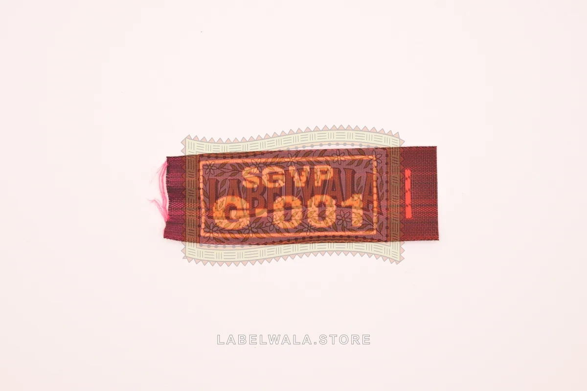 SGVPG woven end fold label, made in Ahmedabad: front view