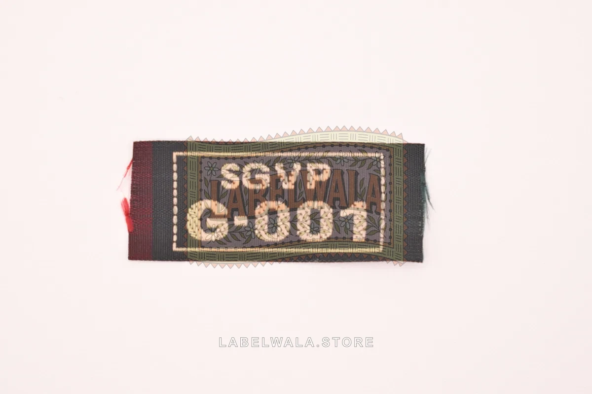 SGVPGBlack woven end fold label, made in Ahmedabad: front view