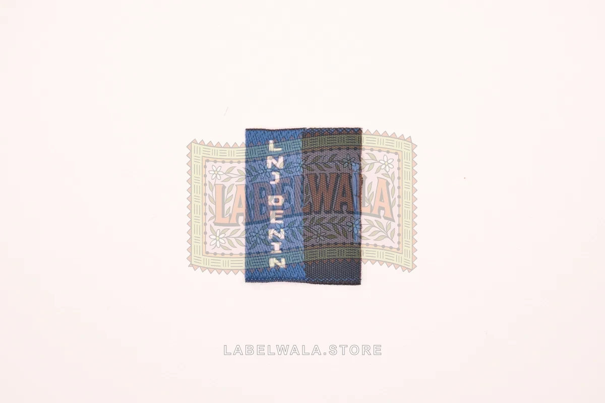 LNJ woven center fold label, made in Ahmedabad: front view