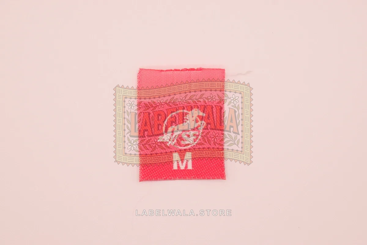 MH woven center fold label, made in Ahmedabad: front view