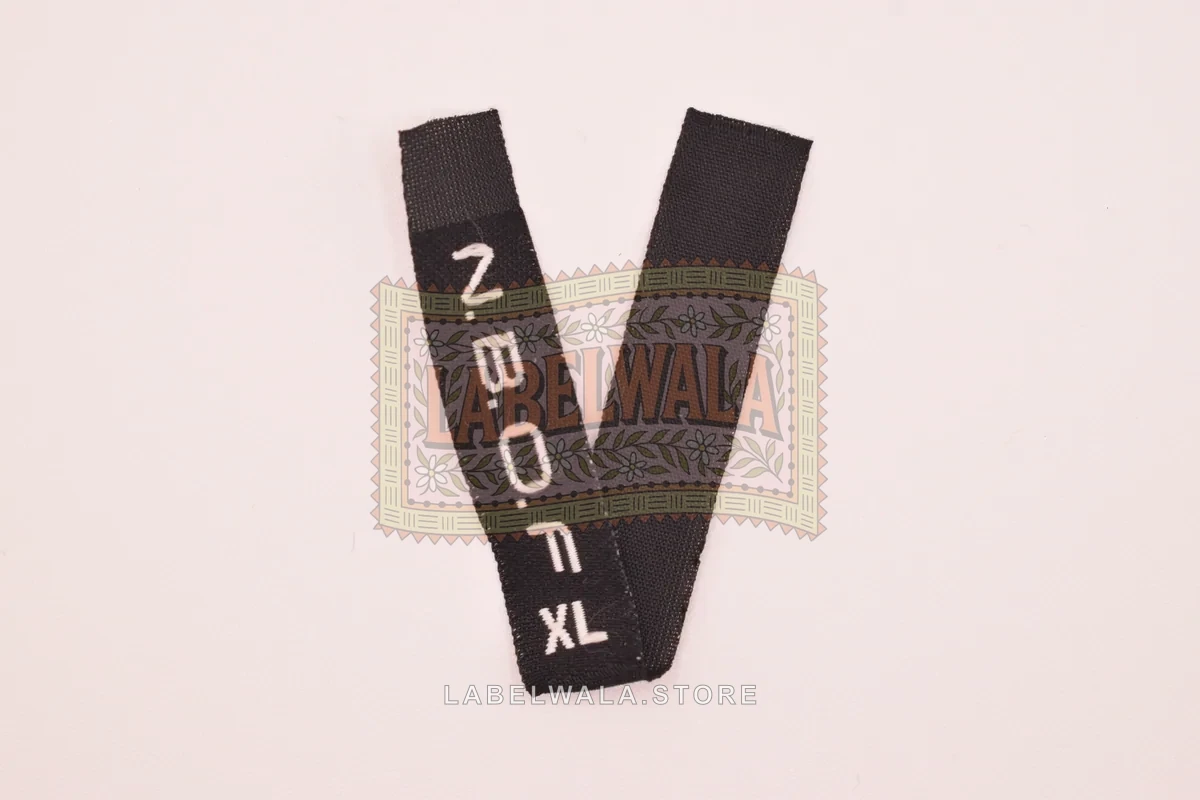 NBOFXL woven center fold label, made in Ahmedabad: front view
