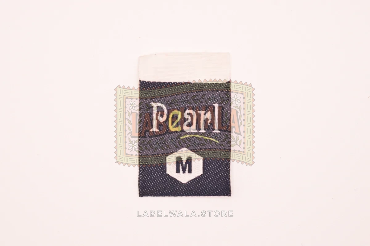 PearlsM woven center fold label, made in Ahmedabad: front view