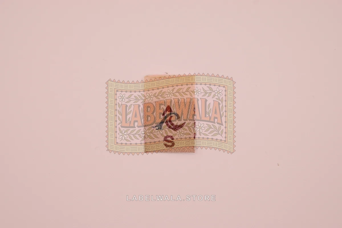 S woven center fold label, made in Ahmedabad: front view