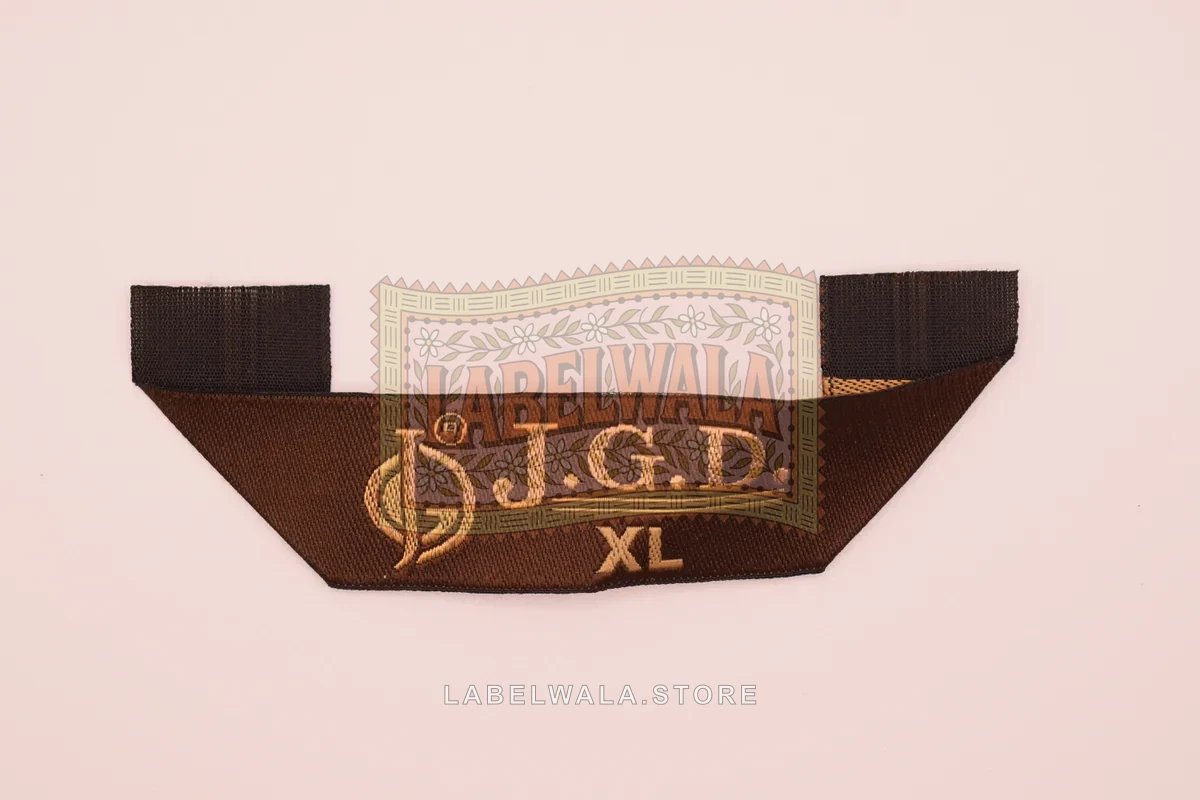 JGD woven hanger loop label, made in Ahmedabad: front view