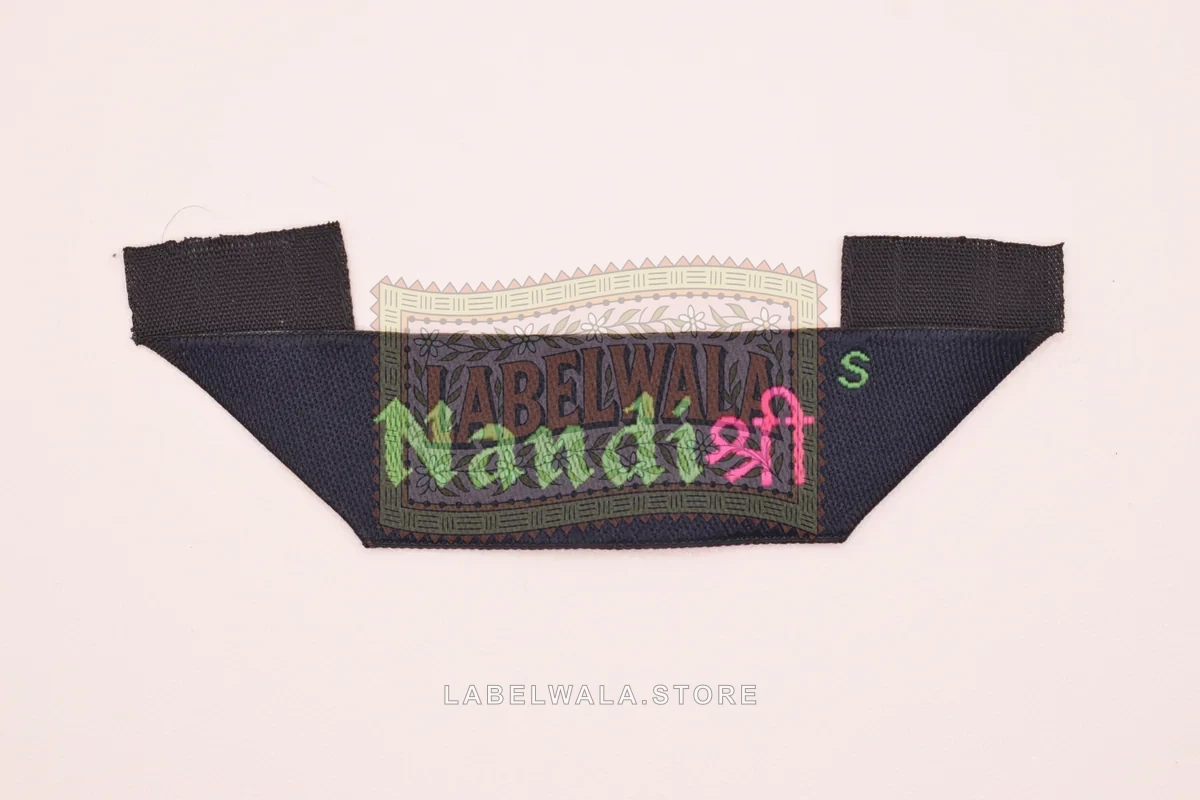 Nandi woven hanger loop label, made in Ahmedabad: front view