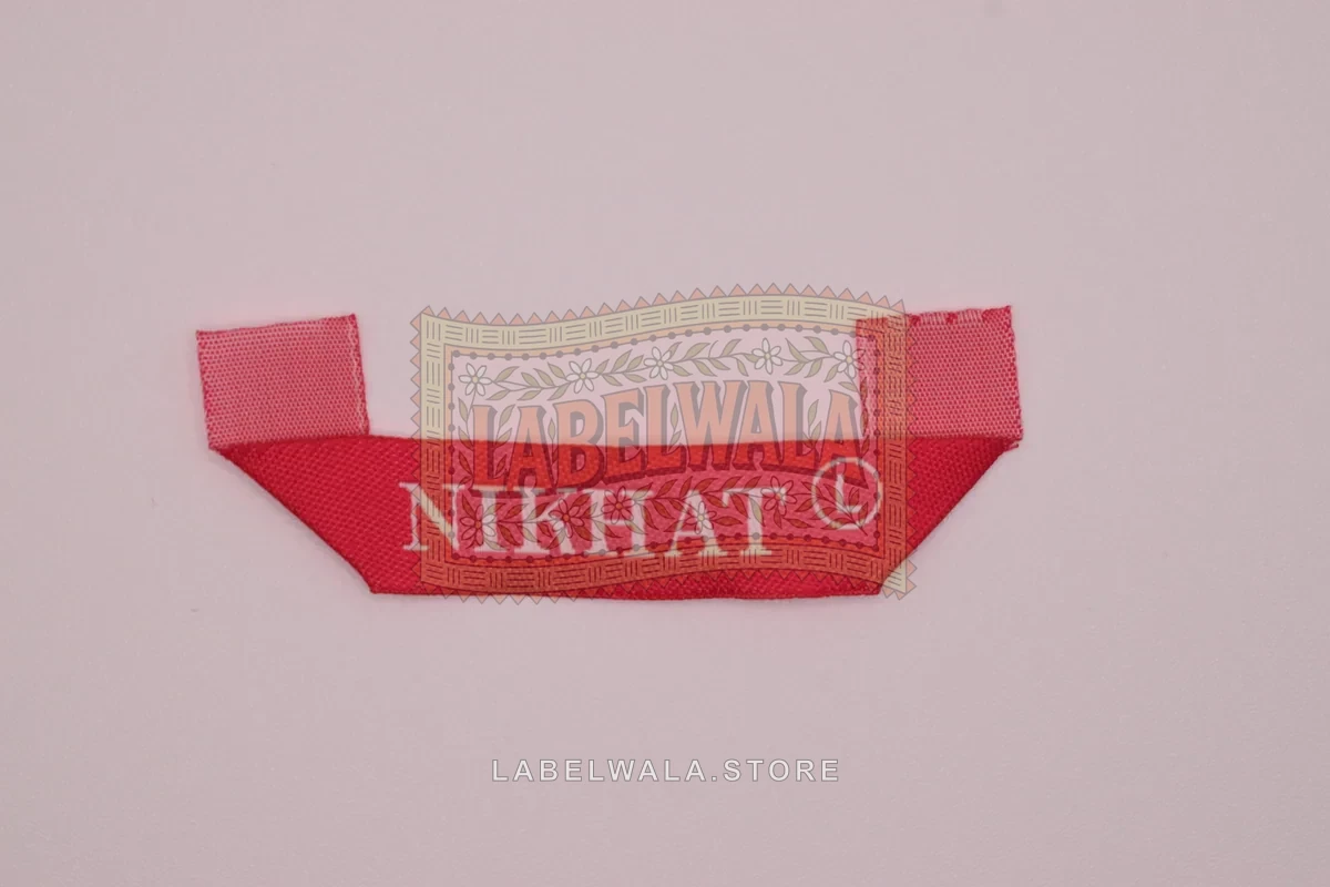 Nikhat woven hanger loop label, made in Ahmedabad: front view