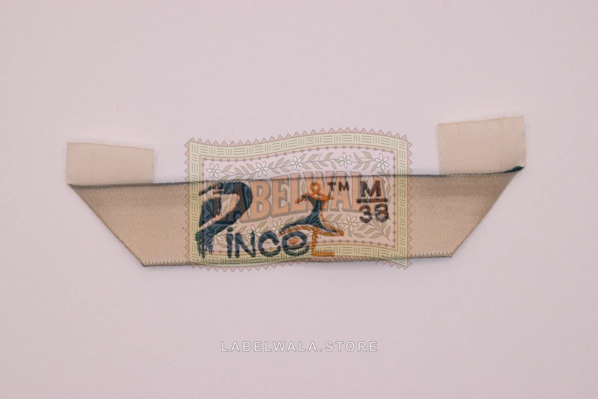 Prince38 woven hanger loop label, made in Ahmedabad: front view
