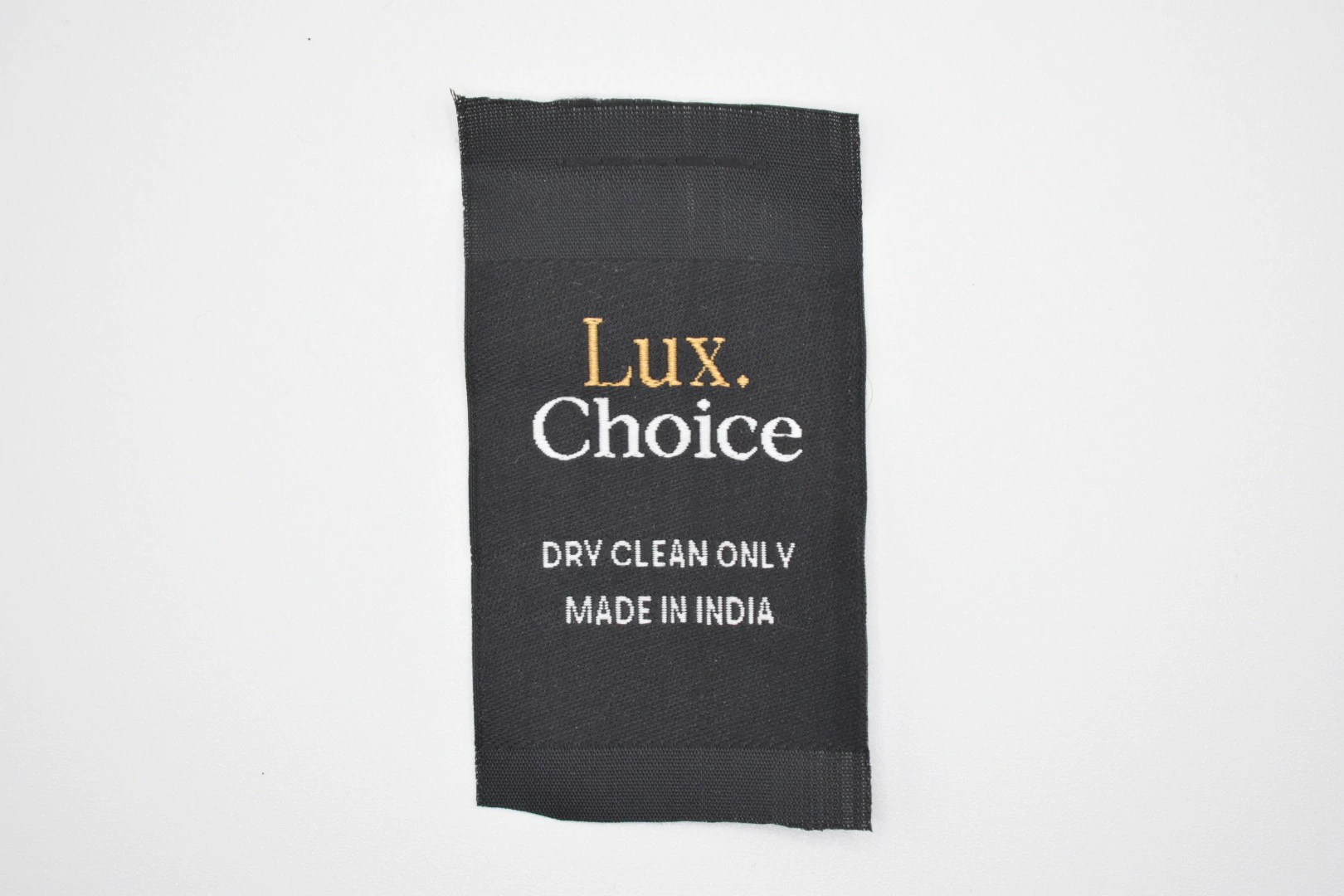 Lux Choice centre-fold woven brand label: front view, premium woven clothing label sample