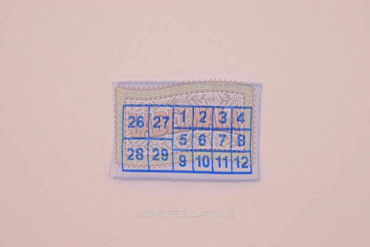 Numbers woven die cut label, made in Ahmedabad: front view