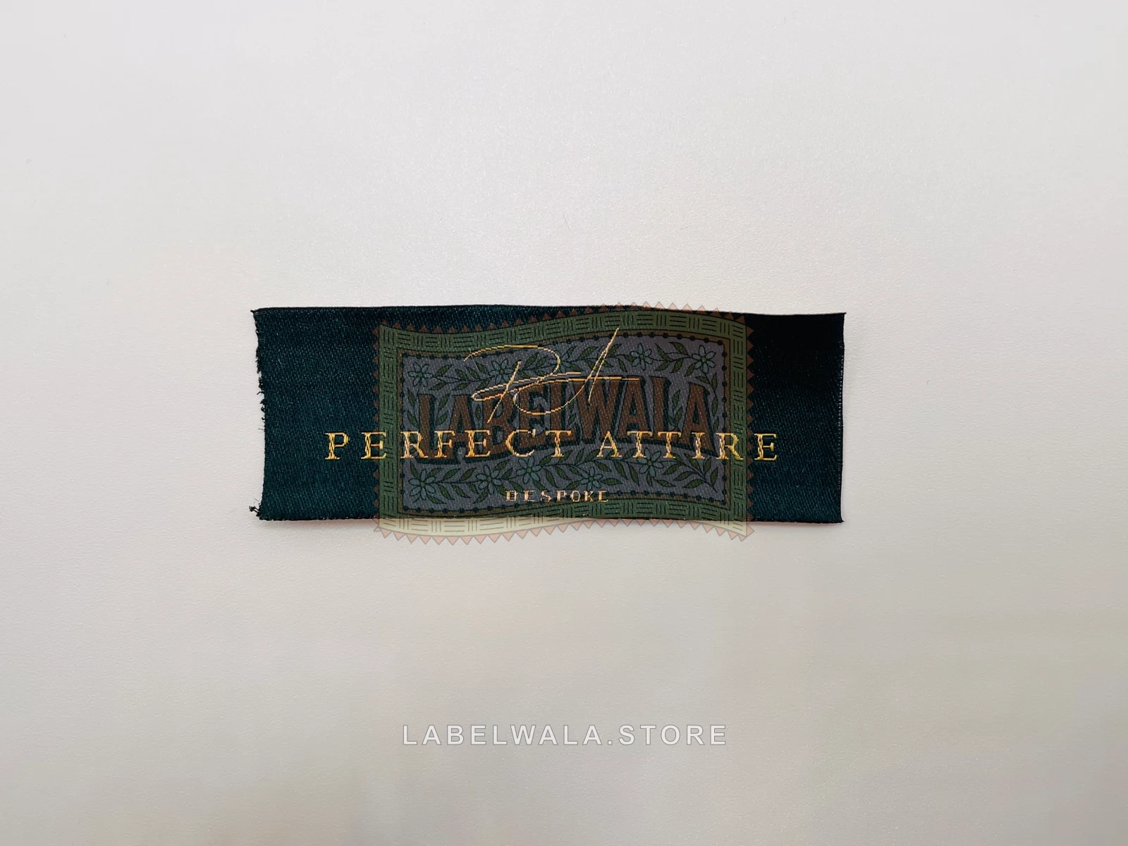 Perfect Attire — Small woven straight cut label, made in Ahmedabad: front view
