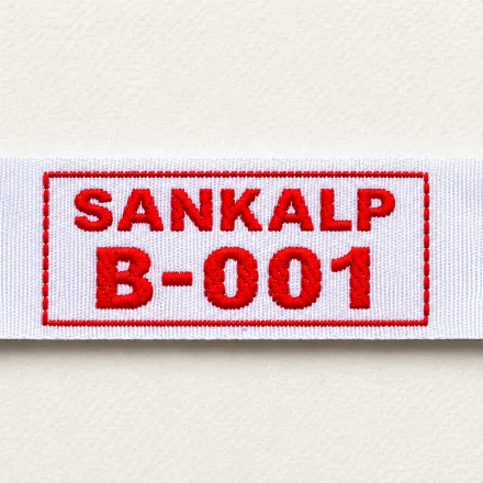 Sankalp B-001 white woven name and number label with red framed identifier: uniform identification woven label sample in red colourway
