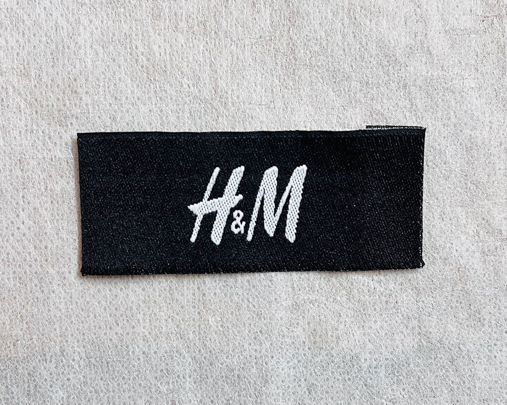 Custom woven label sample on cotton fabric